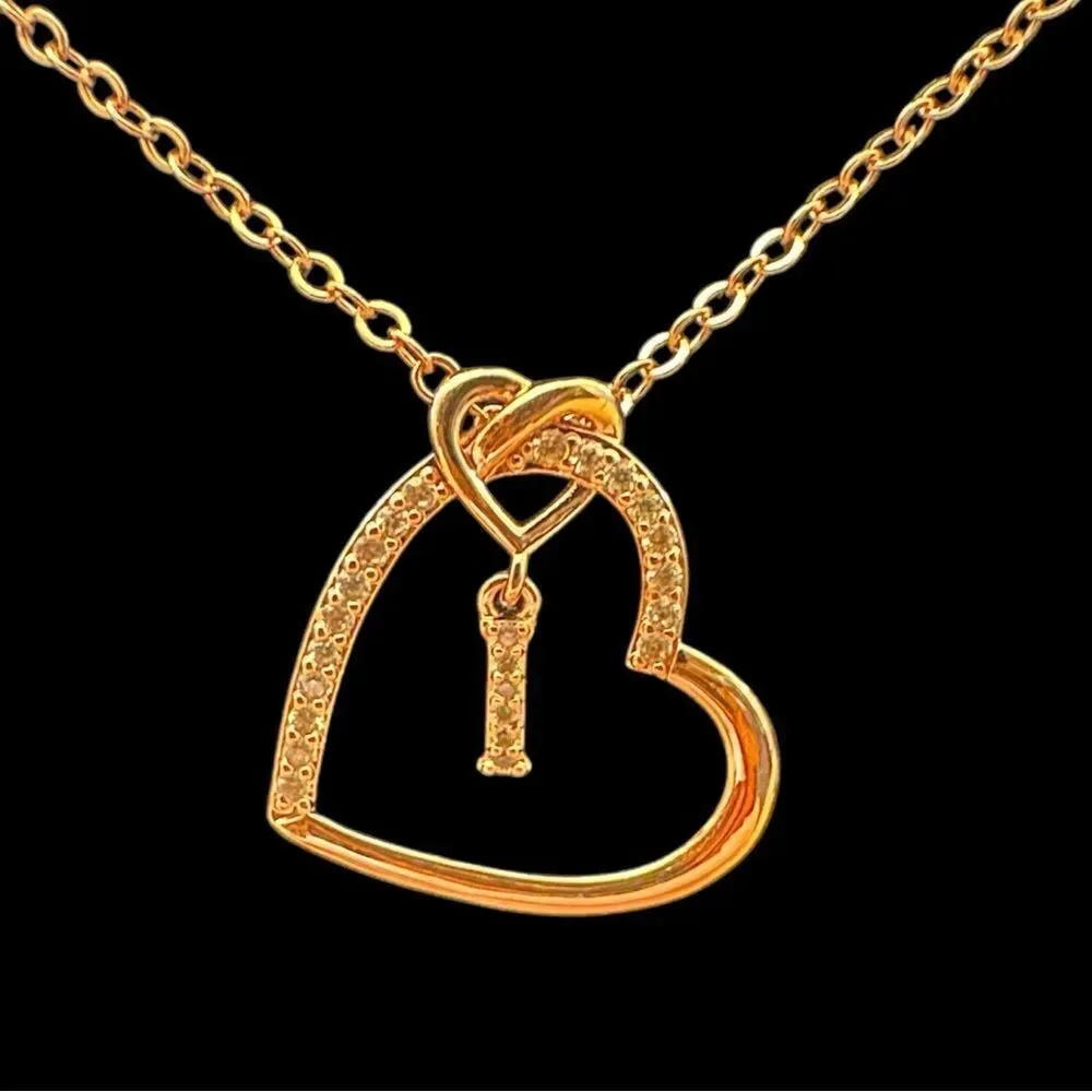 Anoup Rose Gold “I” initial necklace.